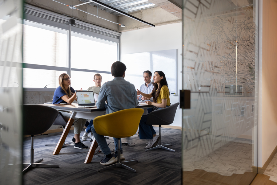 Group of people discussing insurance.