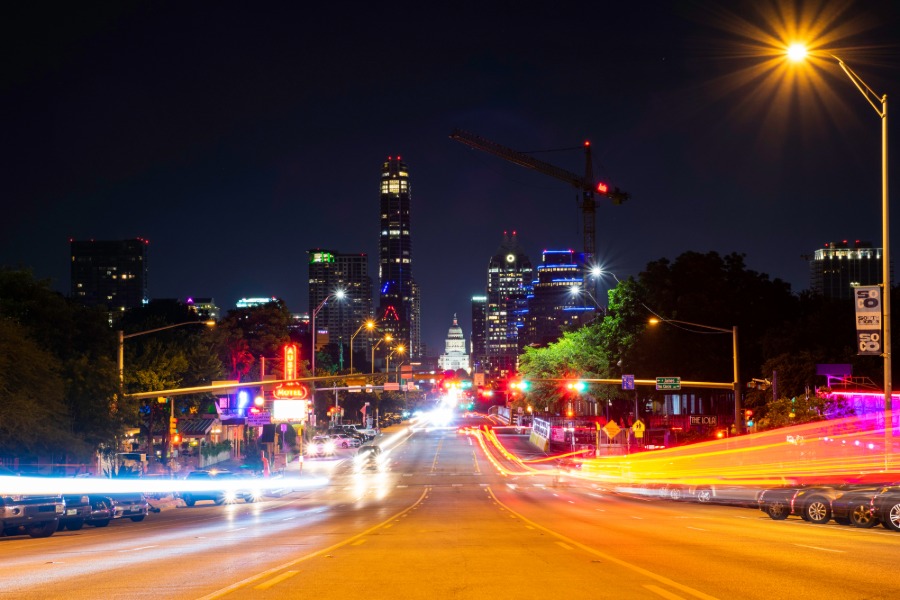 city at night with bright and blurry lights